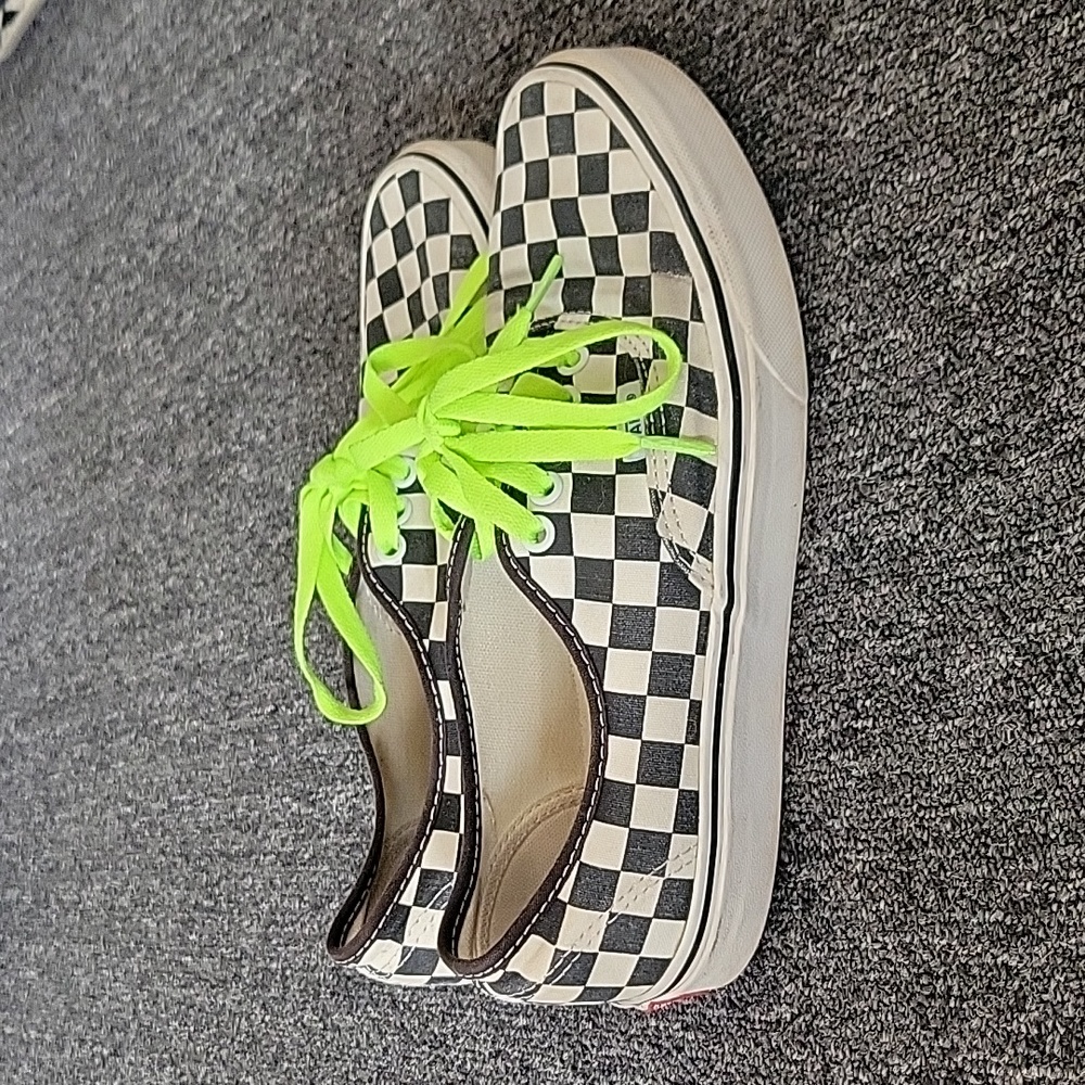 Checkerd vans with neon green laces